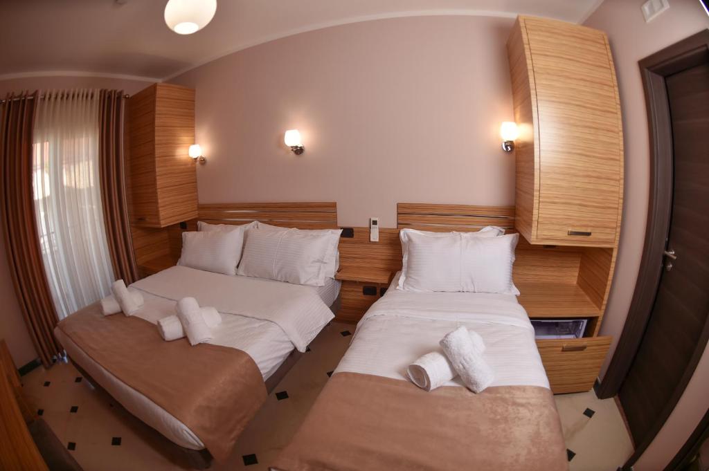 Postel nebo postele na pokoji v ubytování Hotel Pandora Residence