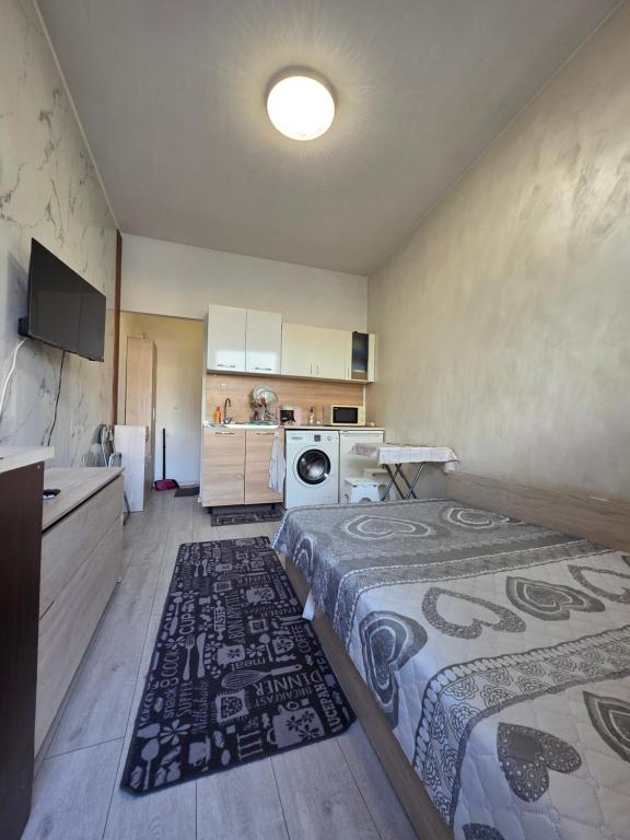 a room with two beds and a kitchen at relax in Plovdiv