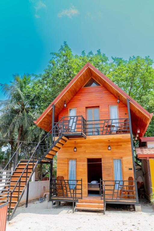 a house with a staircase on the side of it at K Seven Guest Inn in Trincomalee