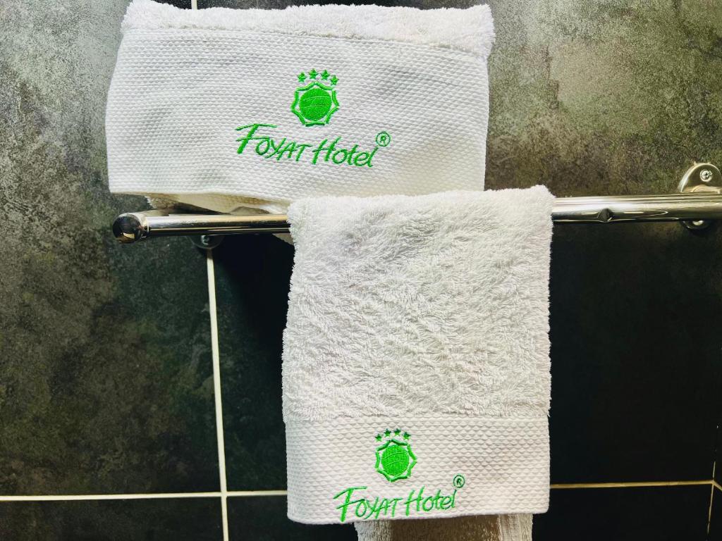 two towels on a towel rack in a bathroom at Foyat Hotel in Addis Ababa