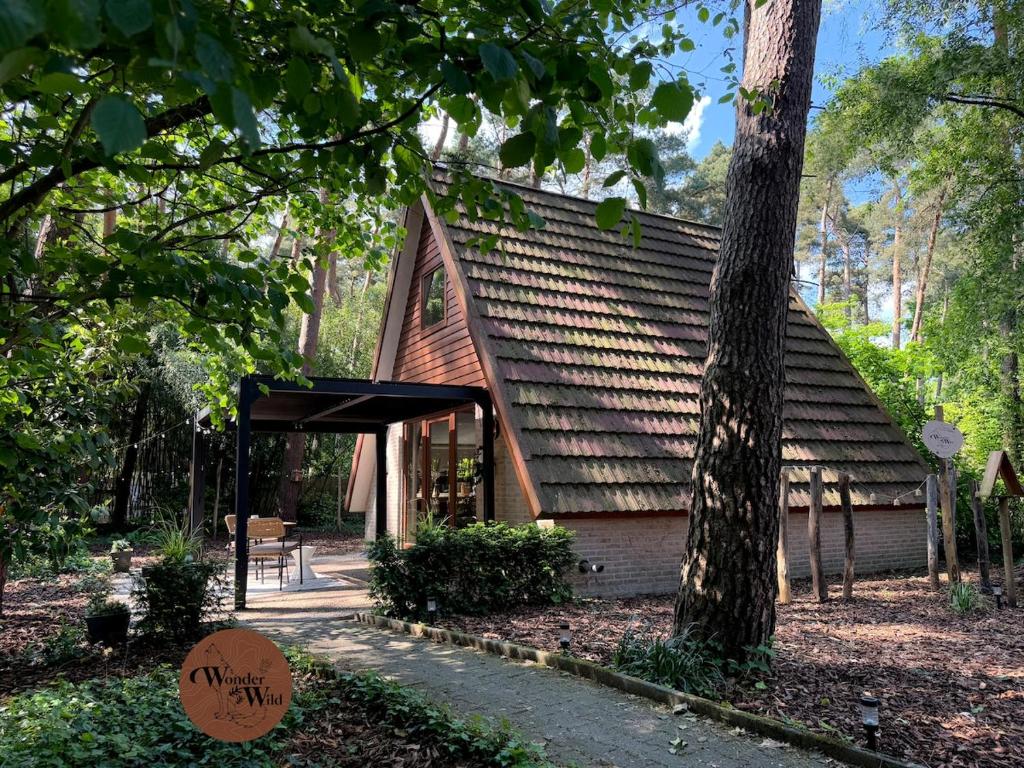 a small chapel with a roof in the woods at Wonderwild C79, Dog Friendly in Lanaken