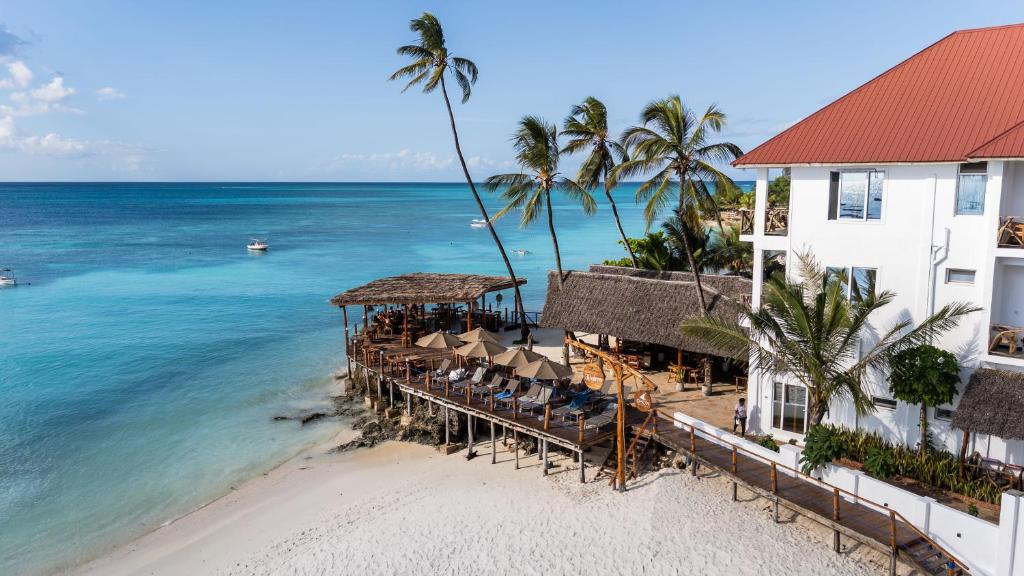 an aerial view of a resort on the beach at Dhow Beach Boutique Hotel in Nungwi