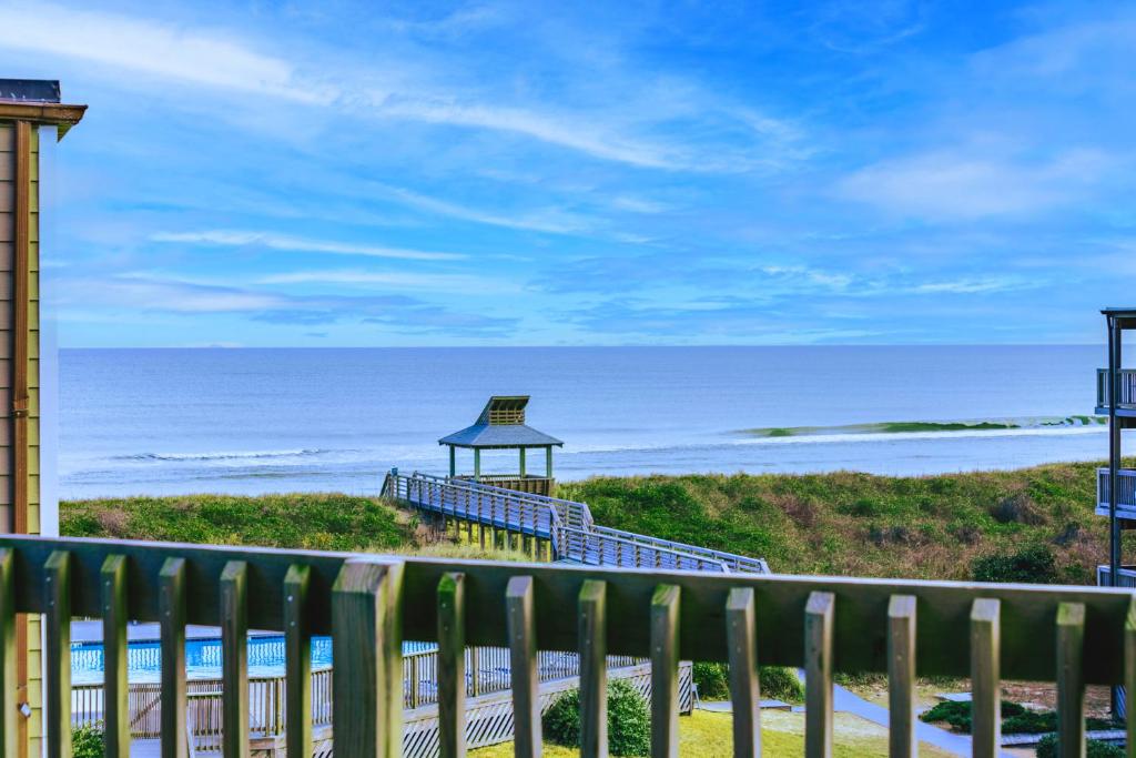 a balcony with a gazebo and the ocean at C308B - Duck Tails in Duck