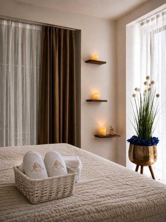 a bedroom with a bed with towels and candles at Lux Line Apartment in Zurich