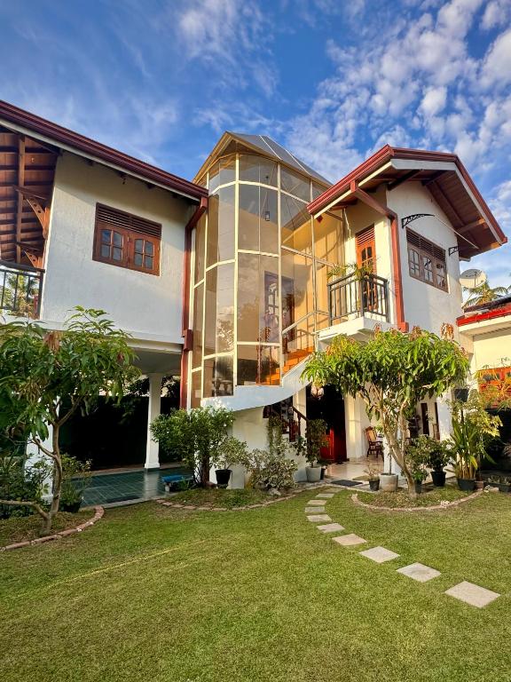 a large house with a lawn in front of it at CFR SkyLine in Katunayaka