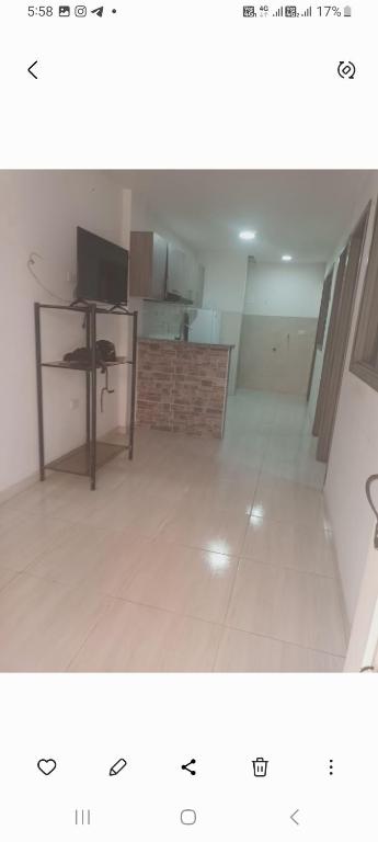 a view of a room with a kitchen and a living room at Lindo apartamento Girón in Girón