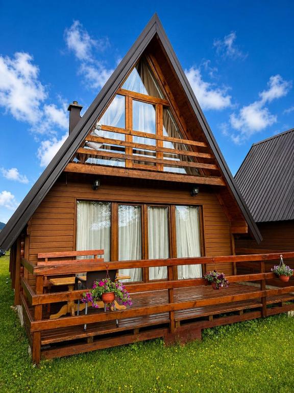 a log cabin with a large window at Villa Wood Borje in Žabljak