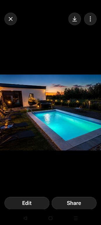 a screenshot of a tv screen with a swimming pool at Green Nest in Laktaši