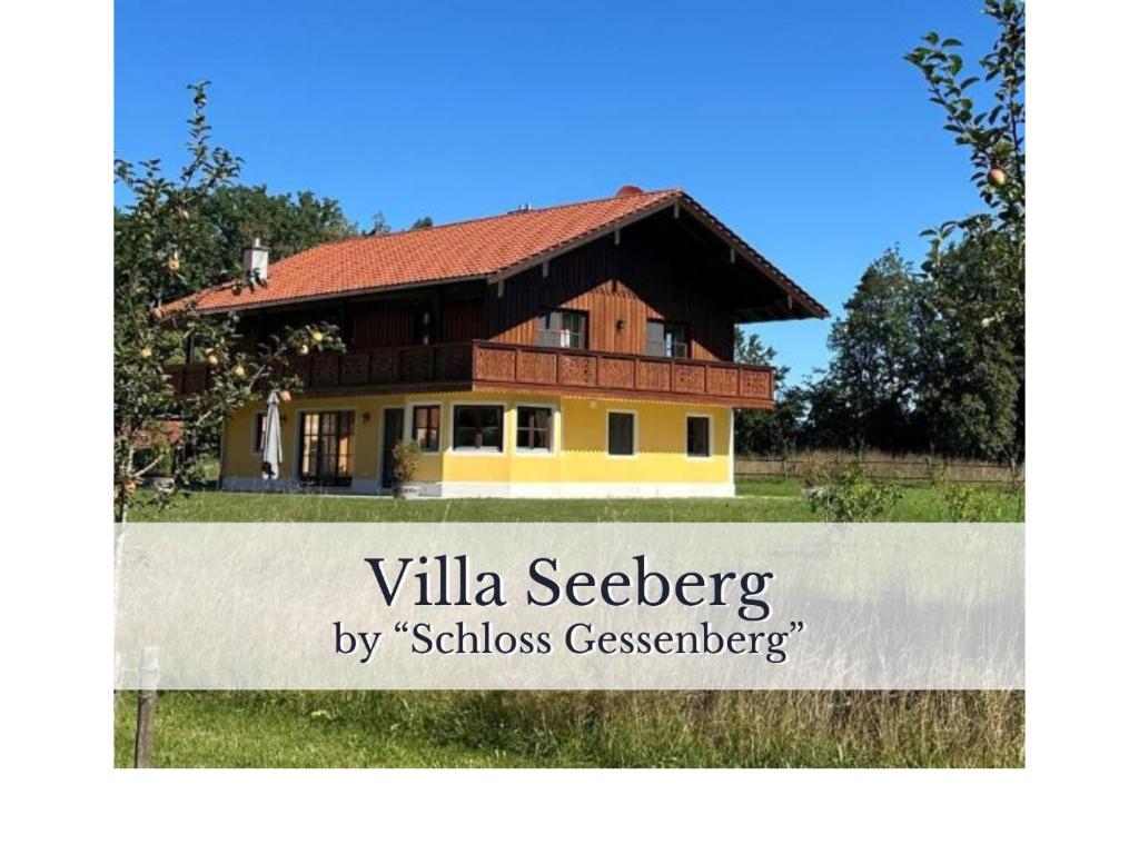 a house with a sign in front of it at VILLA SEEBERG - by "Schloss Gessenberg" luxurious vacation home with lake and mountain views, suitable for families and friends in Petting