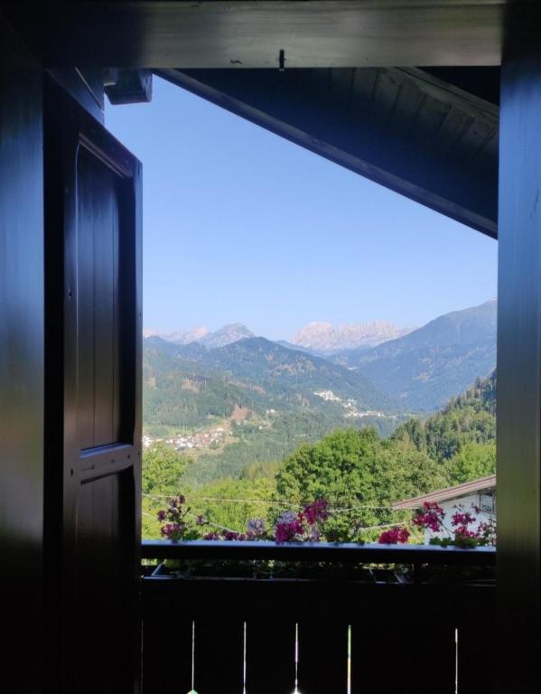 a window with a view of a mountain at Dal Grof in Tualis