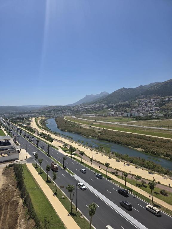 a highway next to a river with cars on it at Apartment Stunning Panoramic View in Tétouan