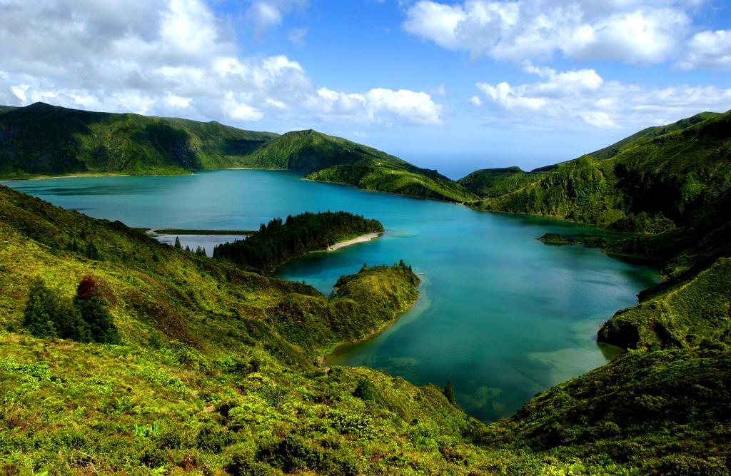 a view of a crater lake in the mountains at Carreiro House in Ponta Delgada