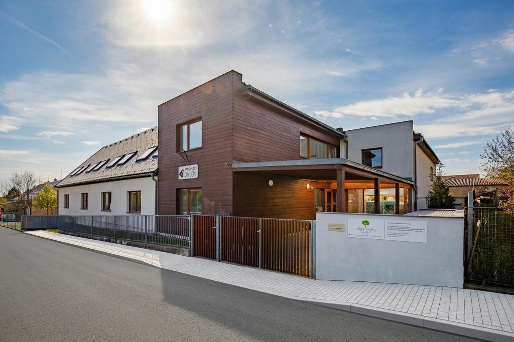 a house with a fence in front of it at Apartmány Dalov in Šternberk