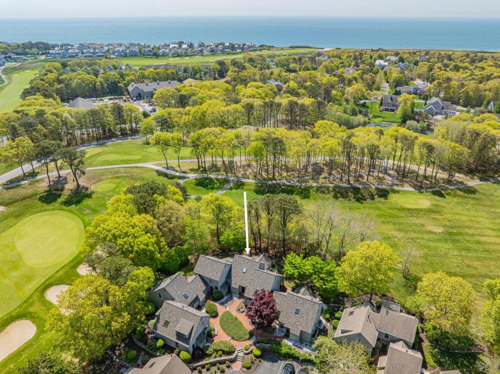 an aerial view of a house and golf course at Sea Spark - Cape Escape with Pool Access in Mashpee