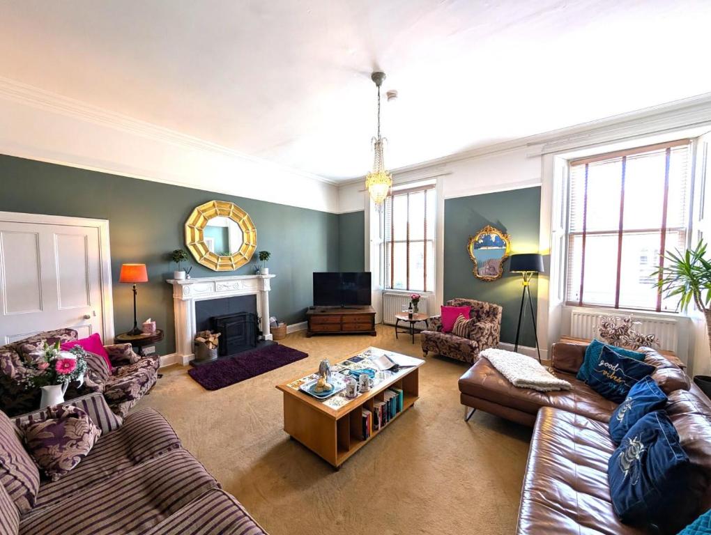 a living room with two couches and a fireplace at 5 Bed in Melrose oc-79418 in Melrose