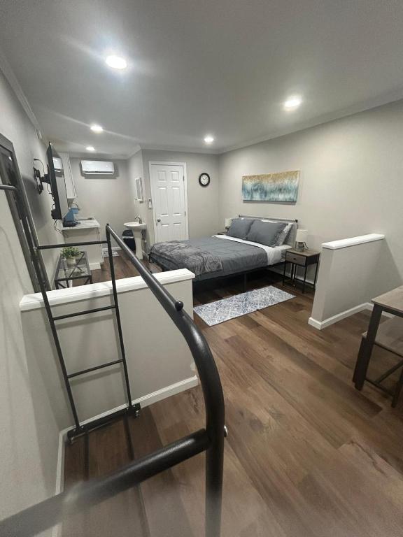 a living room with a couch and a stair case at The Comfort Cove in Cleveland