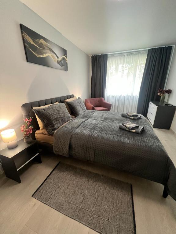 a bedroom with a large bed and a couch at Komarova in Chernivtsi