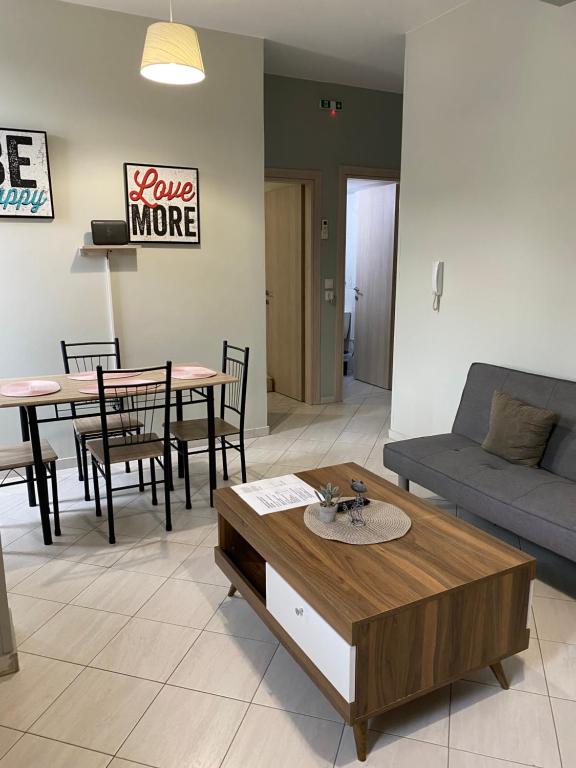 a living room with a couch and a coffee table at Sissy Home -Central Studio in Vathi in Samos