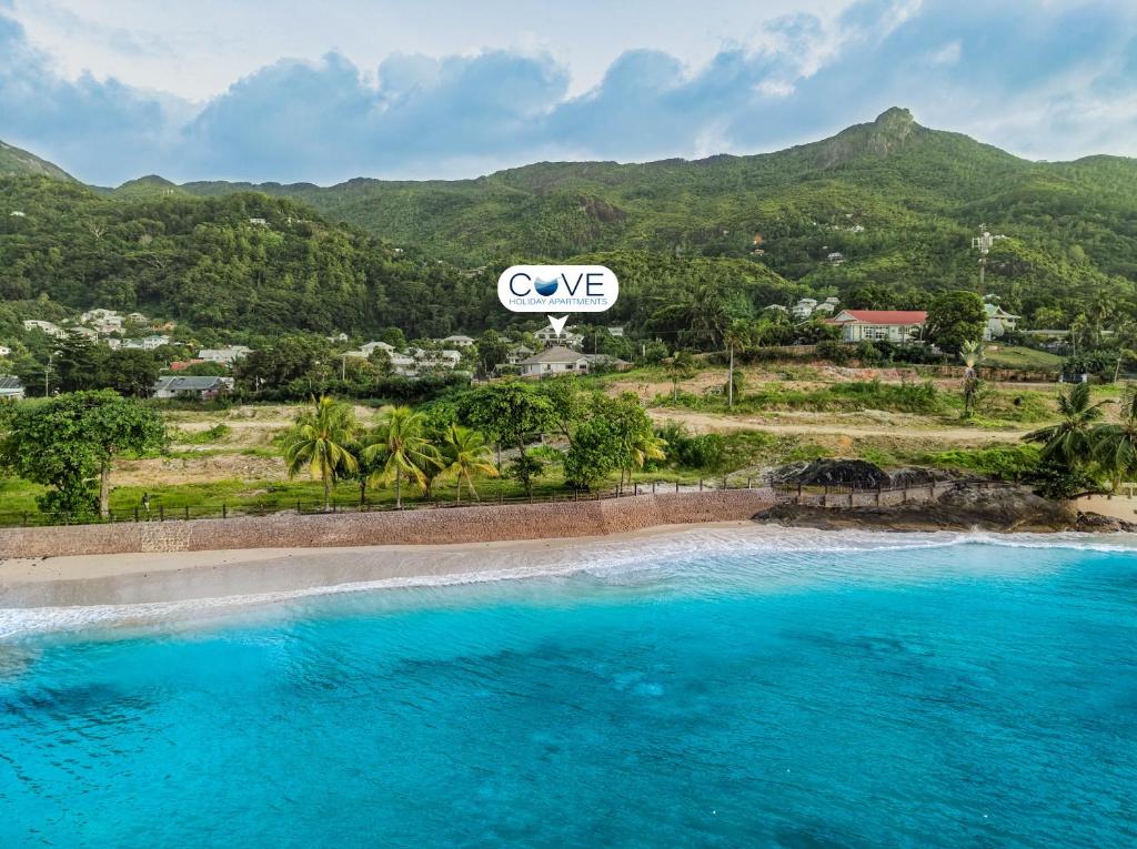 an aerial view of a pool at a resort at Cove Holiday Apartments in Bel Ombre