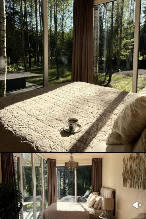 a room with a bed and a large window at For-rest Užsienis in Kazitiškis