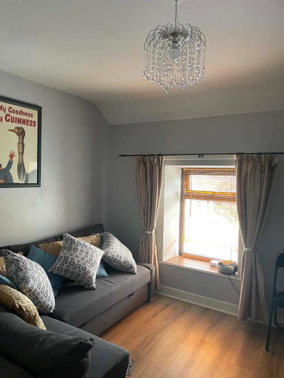 a living room with a couch and a window at 7 Main st in Camlough