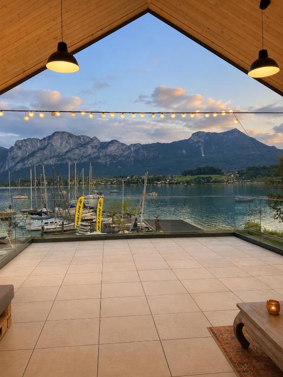 a view from a patio with a view of a marina at Hafenapartments Segelschule Mondsee in Mondsee