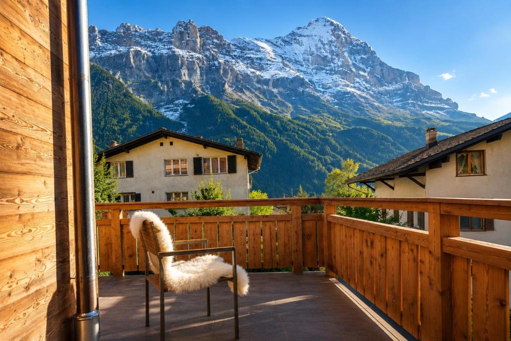 a balcony with a view of a mountain at Brand-New Eiger View 3BR Apartment - Premium Location - Free Parking - Terrace in Grindelwald