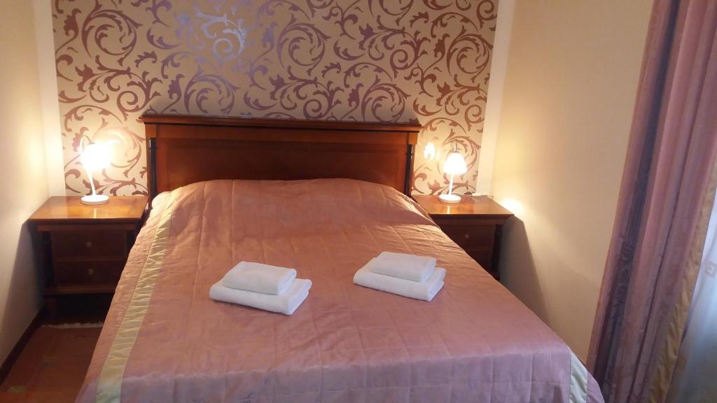Postel nebo postele na pokoji v ubytování Apartma Oranžno Poletje Ljubljanski Dom 5
