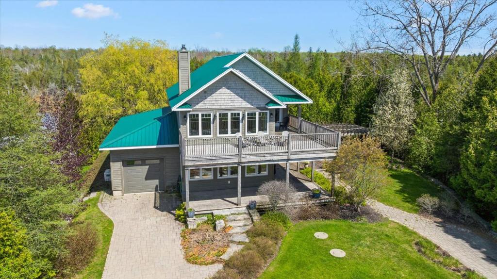 an aerial view of a house with a green roof at Topaz Beach Cottage AC Waterview in Wiarton