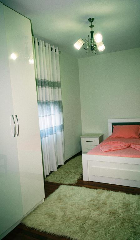 a bedroom with a bed and a chandelier at Home Lin in Lin