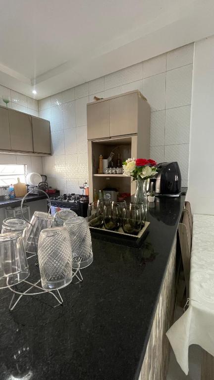a kitchen with two chairs and a counter top at Casa do Mascarenhas in Picos