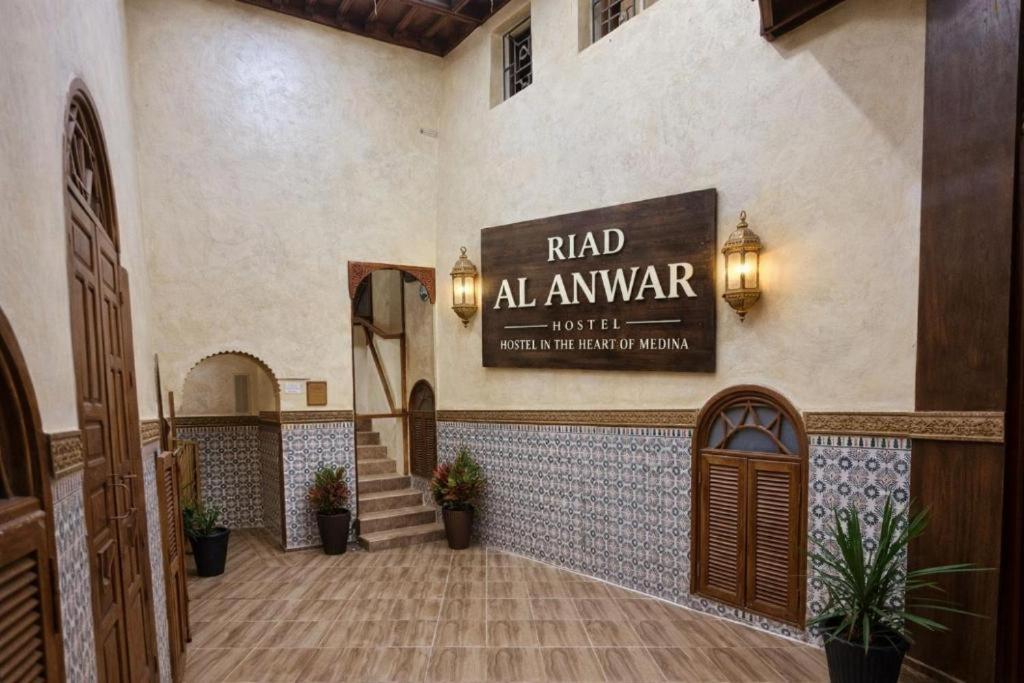 a lobby of a building with a sign that reads raid almanac at Riad Al Anwar in Rabat