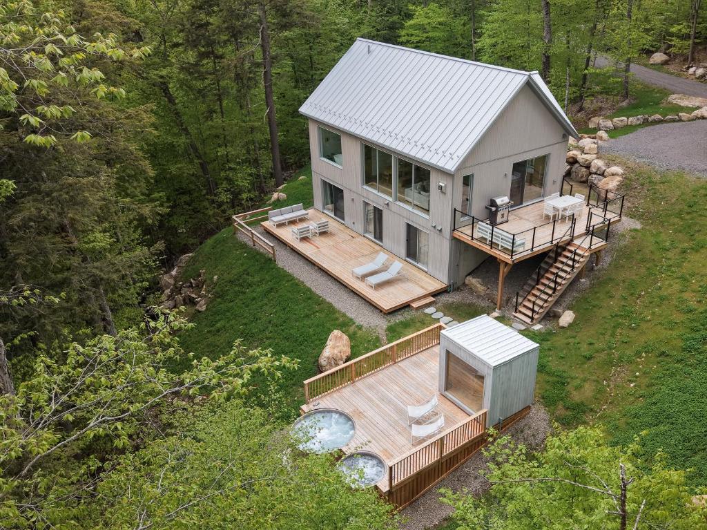 an aerial view of a house with a deck at Private Nordic Spa Retreat - Mont-Tremblant in Lac-Superieur