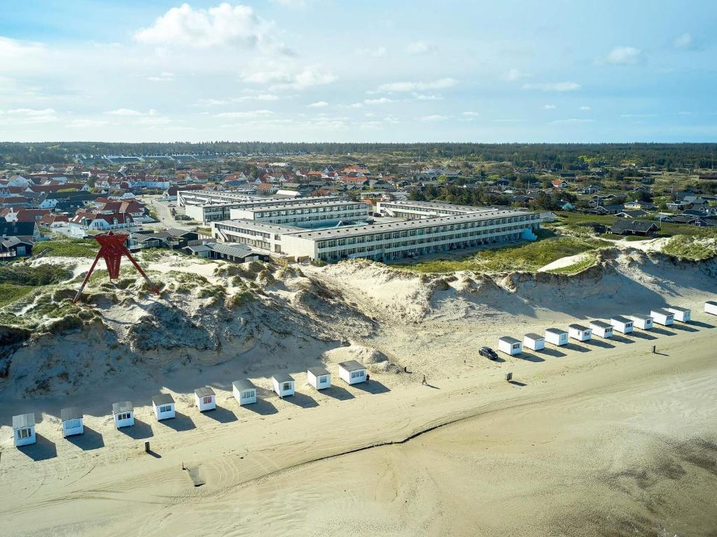 an aerial view of a building on a beach at Apartment on a holiday park in Blokhus in Blokhus