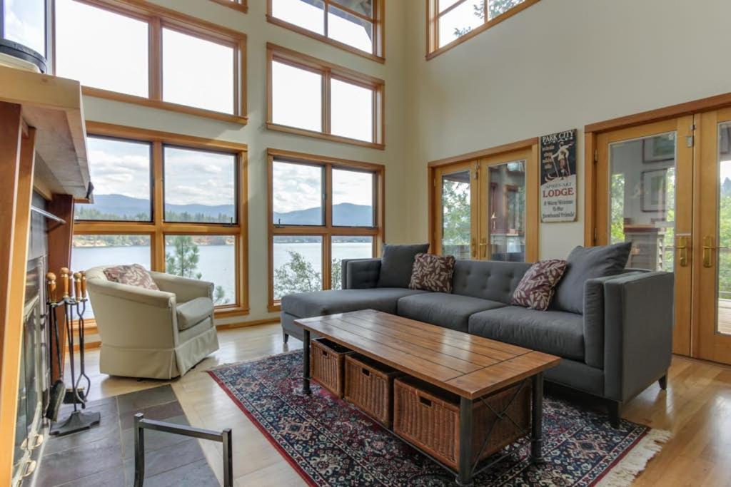 a living room with a couch and a coffee table at Lake House Private Dock & Decks 4BR in Hayden