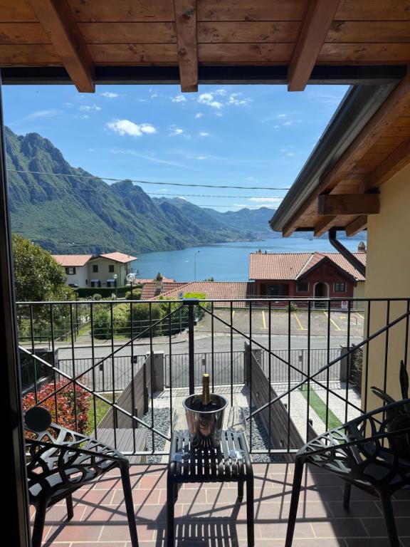 a balcony with a view of a lake and mountains at Casa Amor Iseo Lake in Riva di Solto