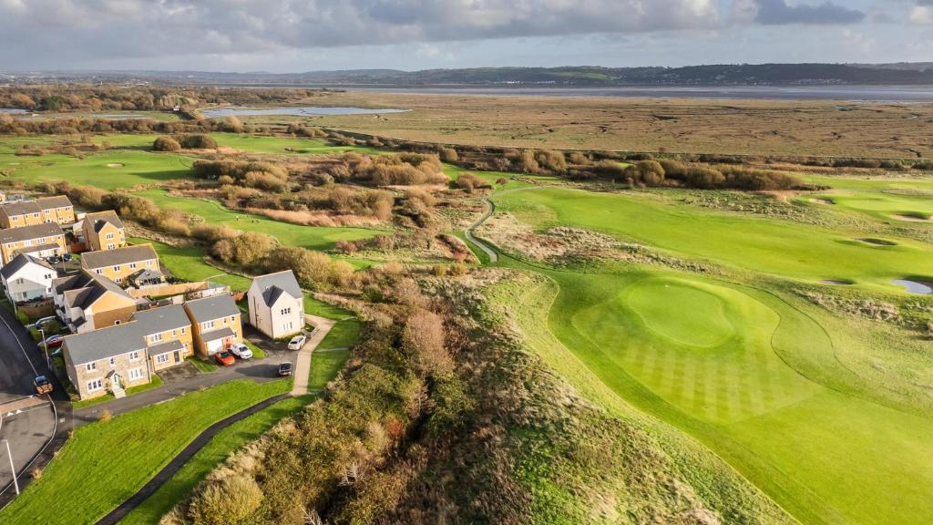 an aerial view of a golf course with a green at 69 Ffordd Y Meillion in Llanelli
