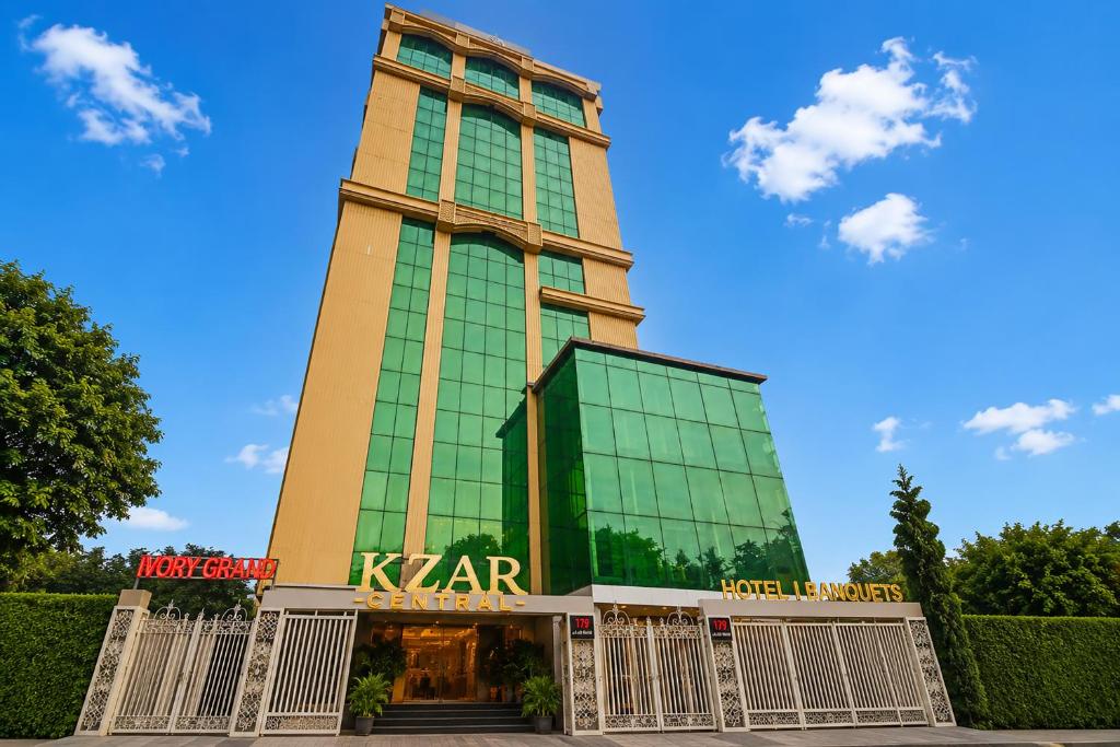 a tall building with a sign on it at Kzar Central in Kolkata
