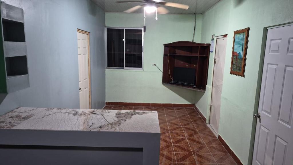 an empty room with a bed and a window at Quinta los almendros in Jabillos