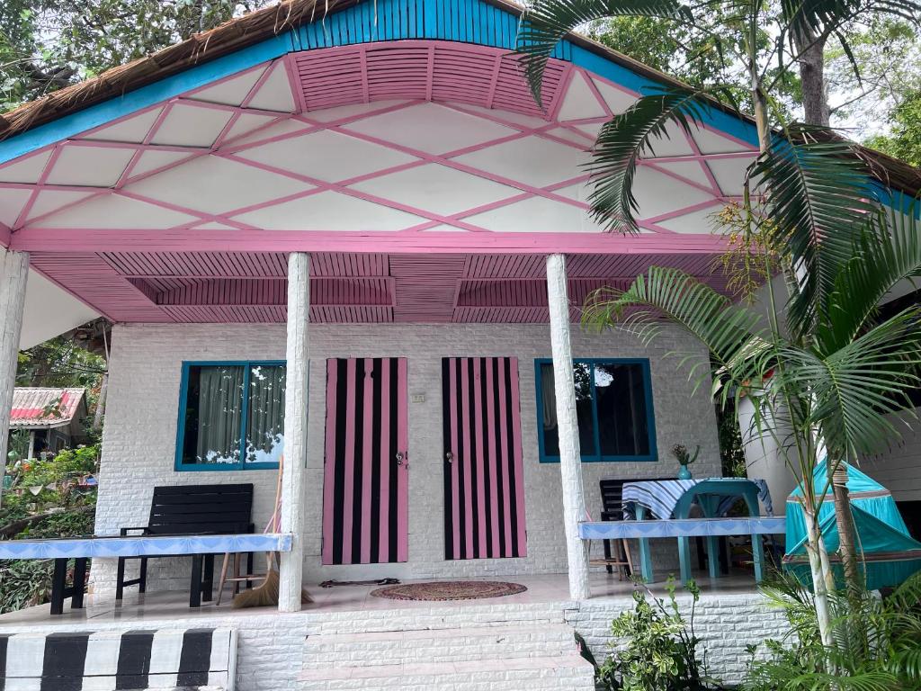a small house with a pink and blue roof at Benny sweet family in Ao Phutsa