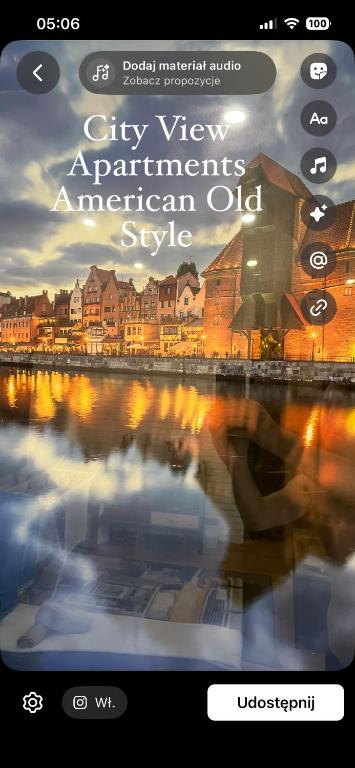 a picture of a city with a boat in the water at Million Gold Gdańsk in Gdańsk