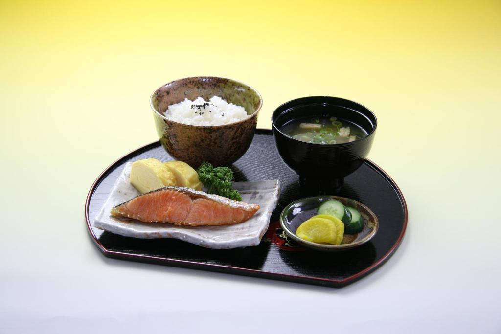 a plate of food with sushi and a bowl of soup at Sari Resort Kashiba (Adult Only) in Kashiba