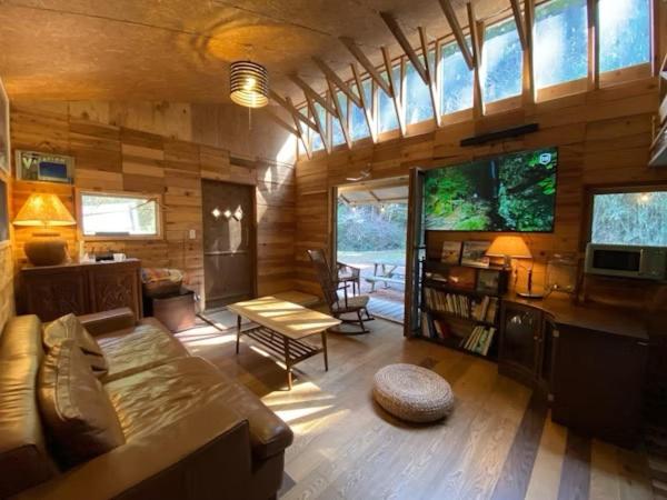 a large living room with a couch and a table at NAT PARK Isumi RV in Iwada