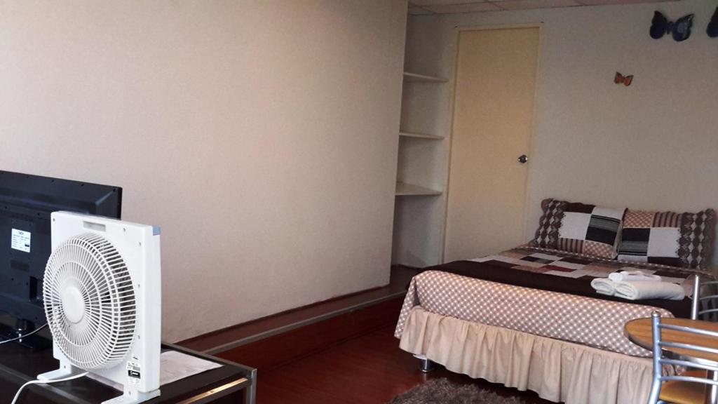 Postel nebo postele na pokoji v ubytování Hotel Pradera Verde Inn
