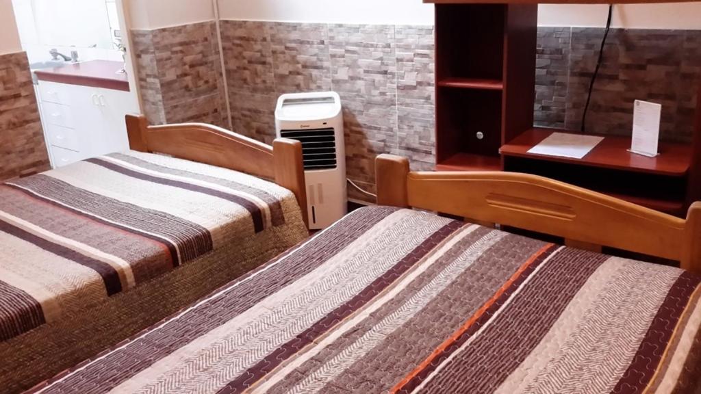 Postel nebo postele na pokoji v ubytování Hotel Pradera Verde Inn