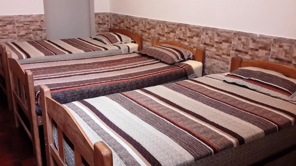 Postel nebo postele na pokoji v ubytování Hotel Pradera Verde Inn