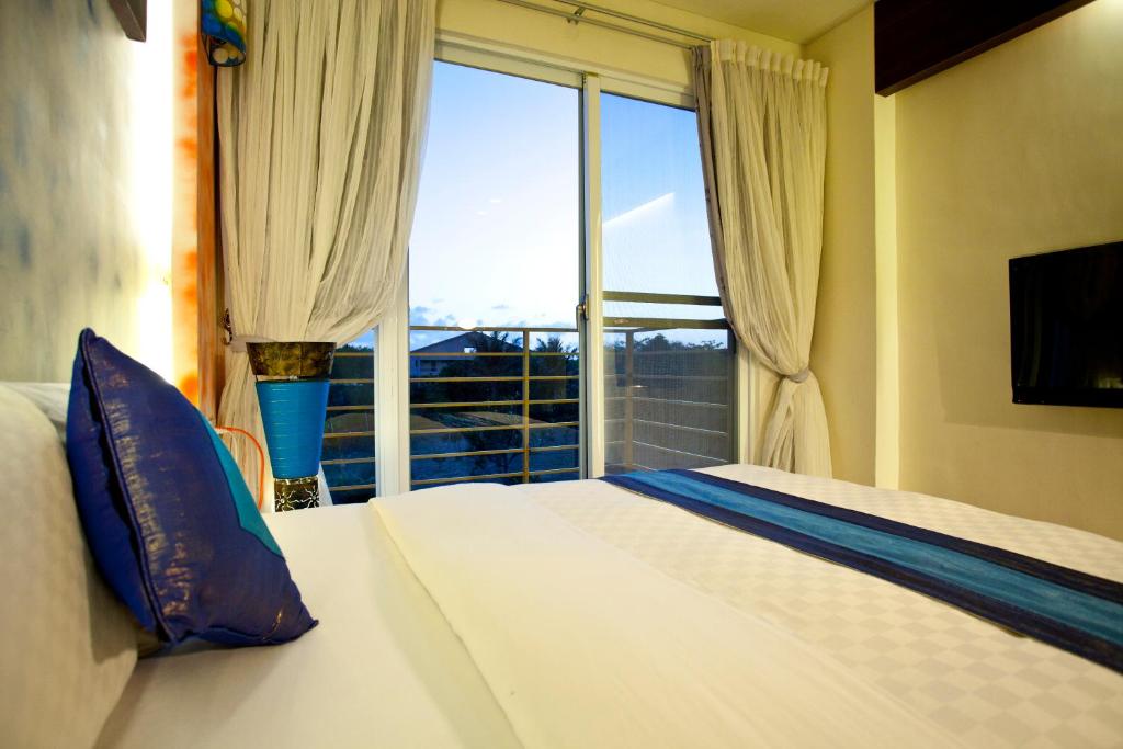 Postel nebo postele na pokoji v ubytování Millennium Inn II