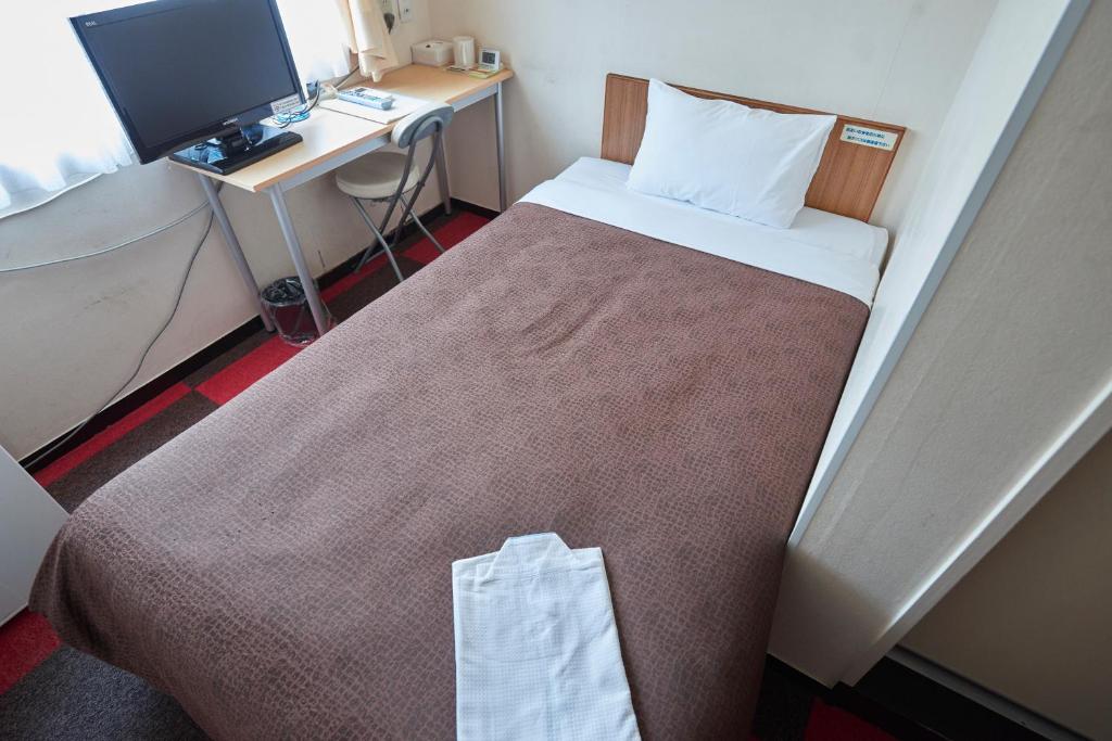 Voodi või voodid majutusasutuse Select Inn Shimada Ekimae toas