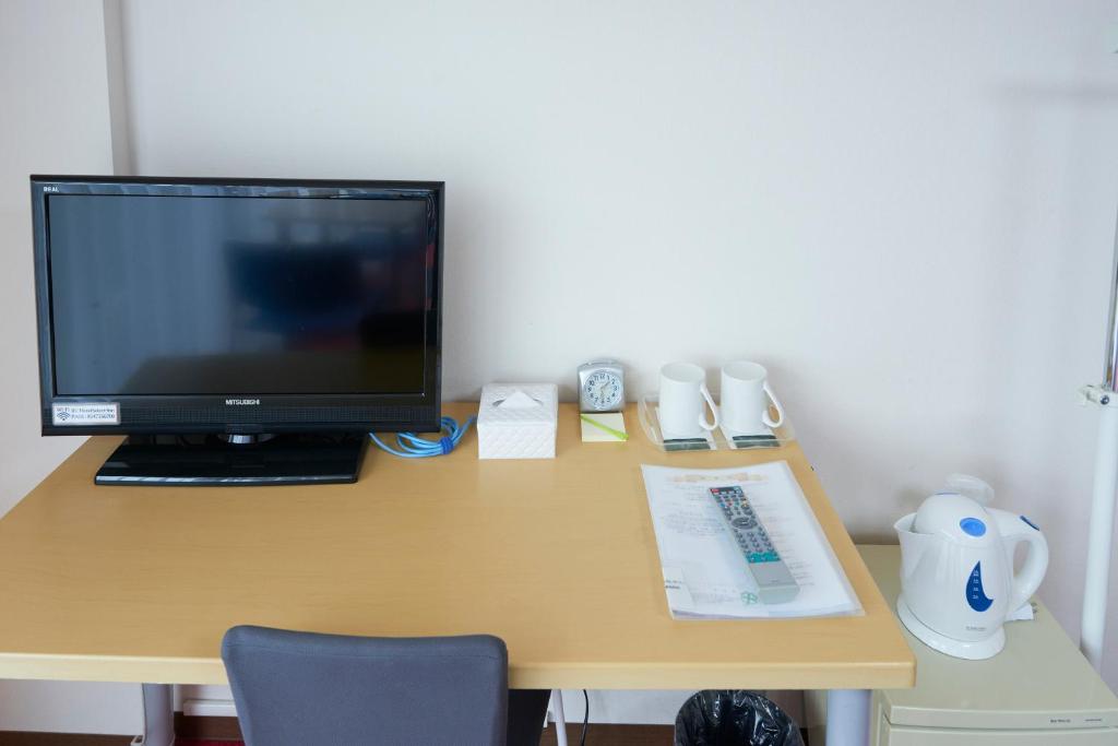 Televiisor ja/või meelelahutuskeskus majutusasutuses Select Inn Shimada Ekimae