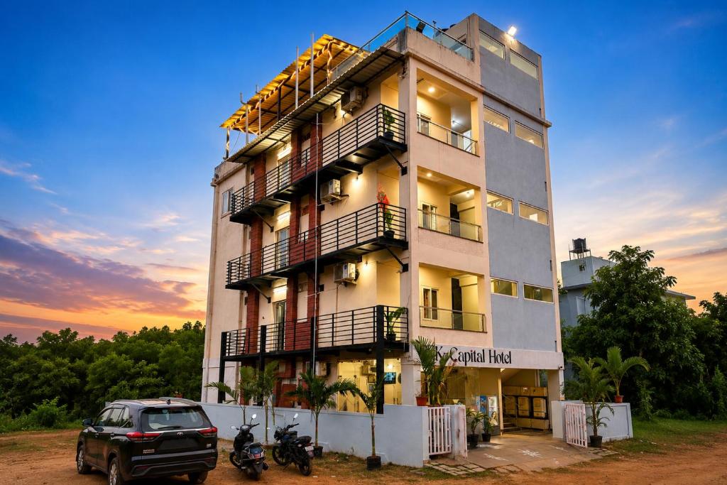 a building with a car parked in front of it at The capital hotel in Visakhapatnam